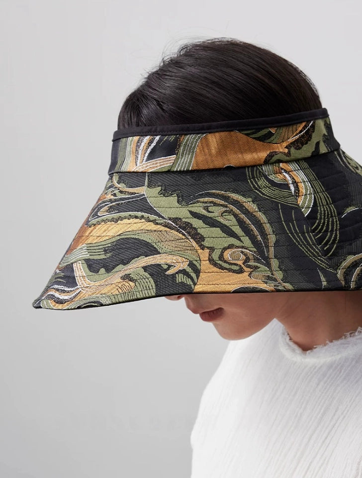 Antique olive jacquard sun visor hat with foldable wide brim and adjustable fit for beach and travel.