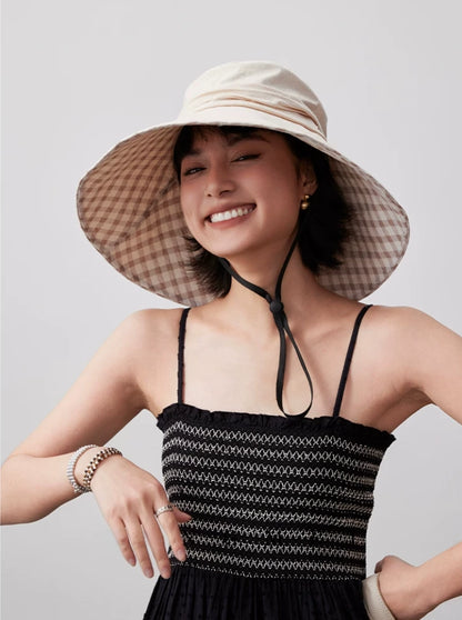 Khaki foldable cotton sun hat with wide brim, plaid lining, and adjustable chin strap