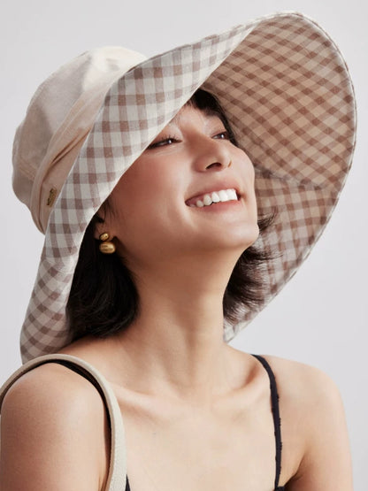 Close-up of khaki wide brim sun hat showing soft cotton brim and plaid lining