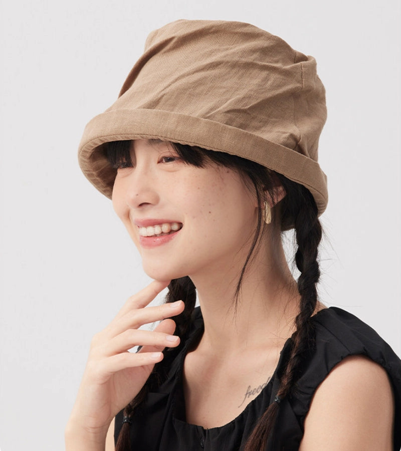 Khaki rolled brim linen bucket hat for women with natural crinkled texture and minimalist look