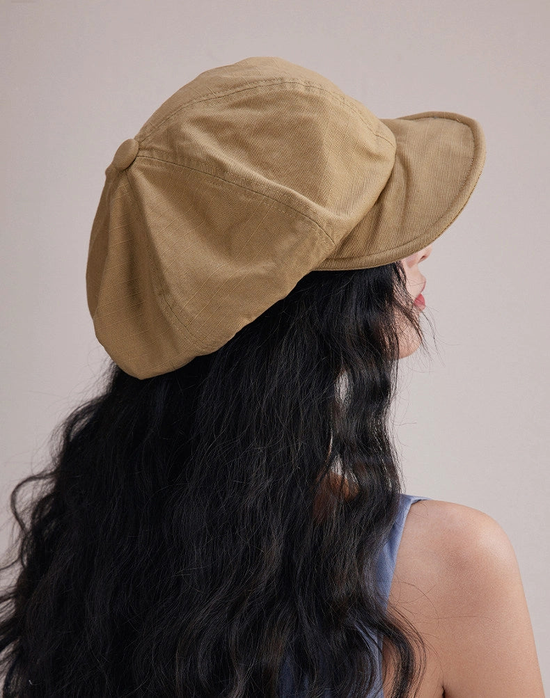 Side view of model wearing khaki slouchy cotton beret hat, a lightweight cotton beret for relaxed daily outfits