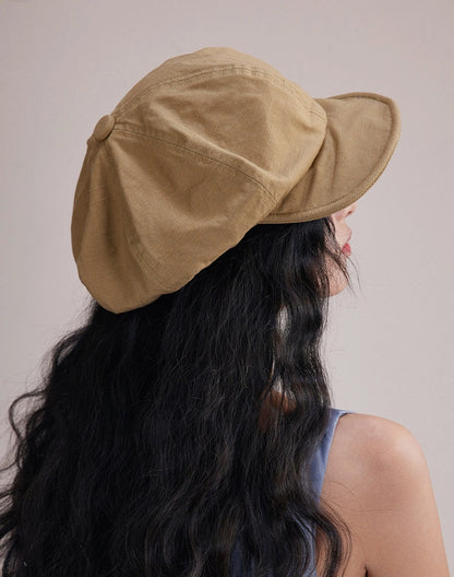 Side view of model wearing khaki slouchy cotton beret hat, a lightweight cotton beret for relaxed daily outfits