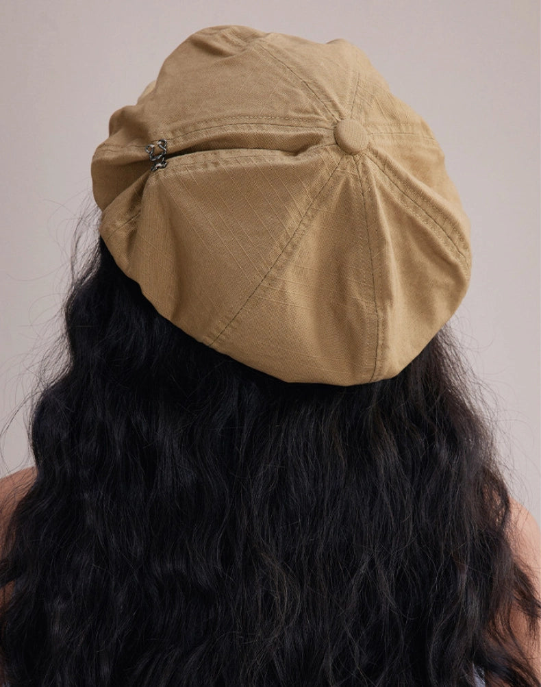 Back view of khaki slouchy cotton beret cap with soft gathered shape and effortless casual silhouette