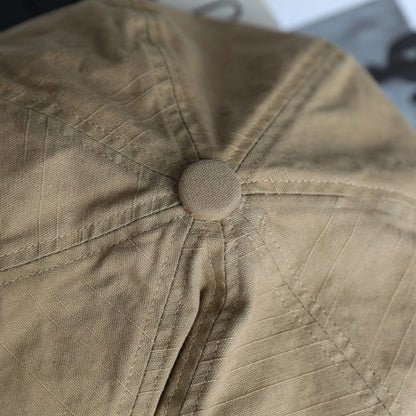 Close-up of khaki slouchy cotton beret showing soft cotton texture, stitched panels, and gathered top detail
