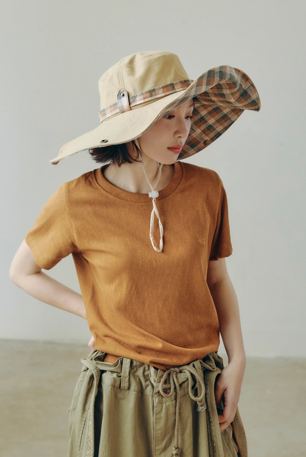 Khaki and plaid wide brim sun hat with string, styled for hiking, camping, travel, and daily sun shade.
