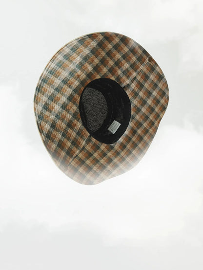 Top view of plaid wide brim outdoor sun hat with adjustable inner band and breathable linen texture.