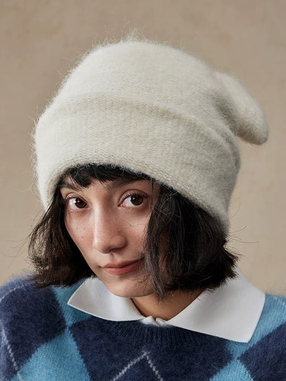 Front view of a cream white koala ear knit beanie with a wide folded brim.