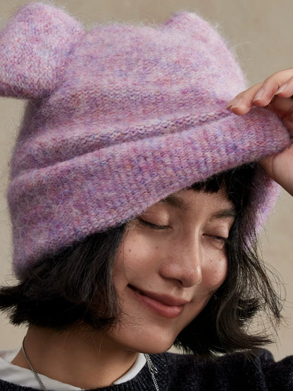 Close-up of a misty lavender koala ear knit beanie showing its folded brim and marled texture.