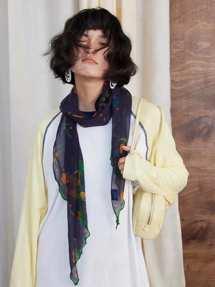 Midnight blue botanical mulberry silk scarf styled for casual elegance