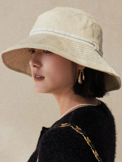 Side view of milky apricot UV protection sun hat with soft wide brim and minimalist design