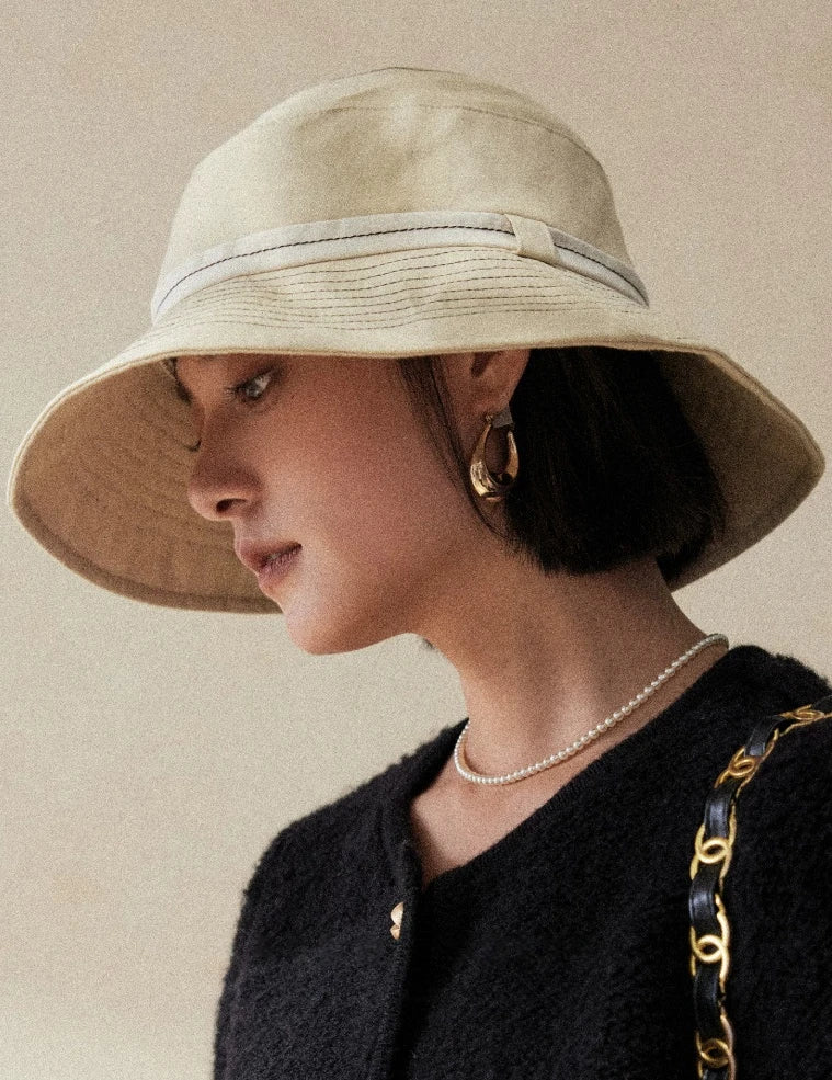 Milky apricot packable bucket hat for travel beach outings and outdoor sun protection