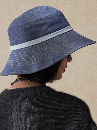 Back view of mist blue UV protection sun hat with wide brim and elegant travel-ready design