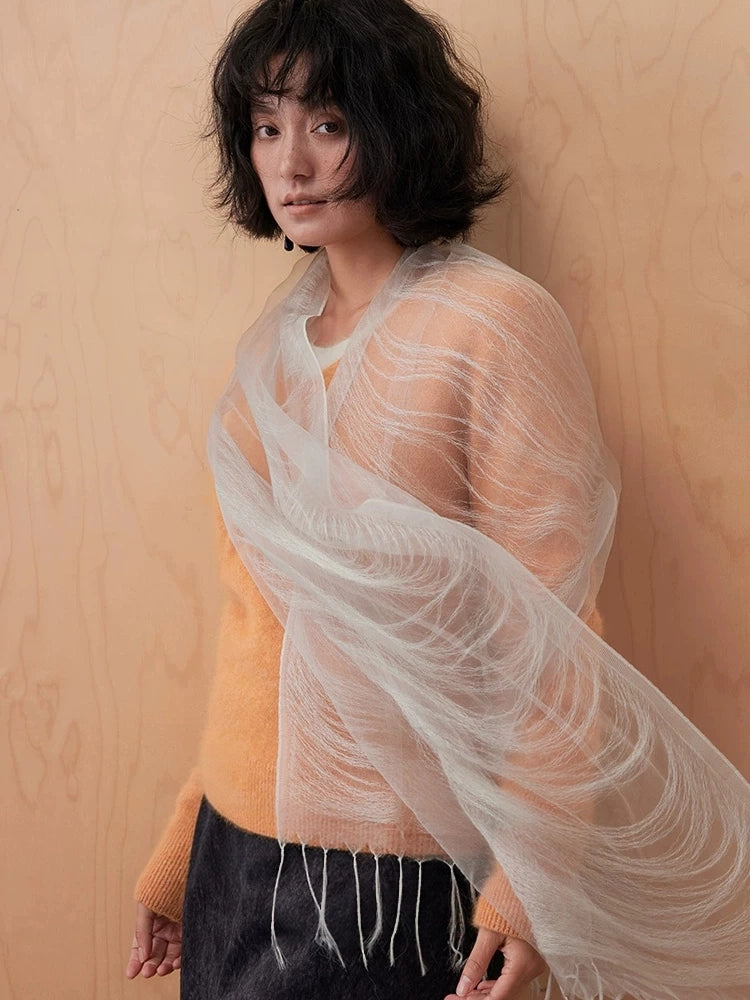 Mist gray mulberry silk scarf draped diagonally across the shoulders with delicate fringe