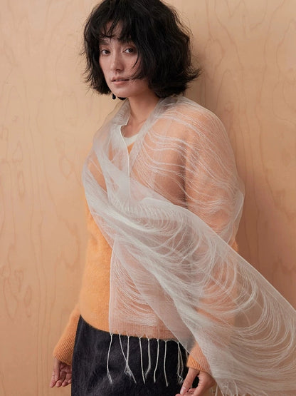 Mist gray mulberry silk scarf draped diagonally across the shoulders with delicate fringe