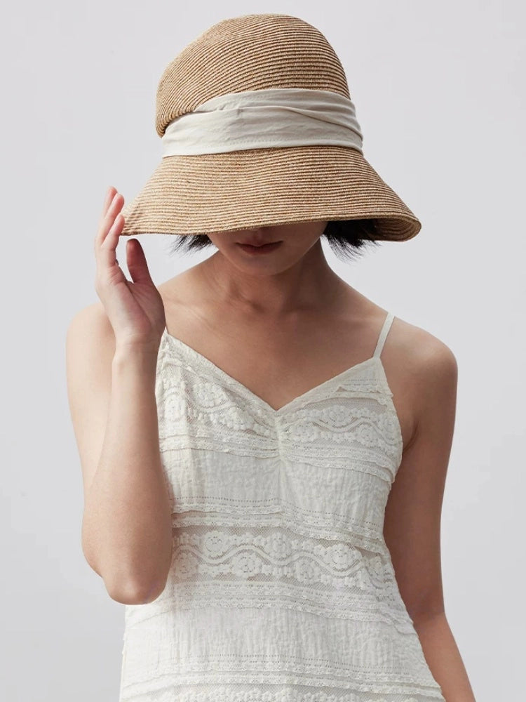 Moonlight white wide brim straw sun hat with elegant ribbon accent, styled for vacation, beach and summer wear.