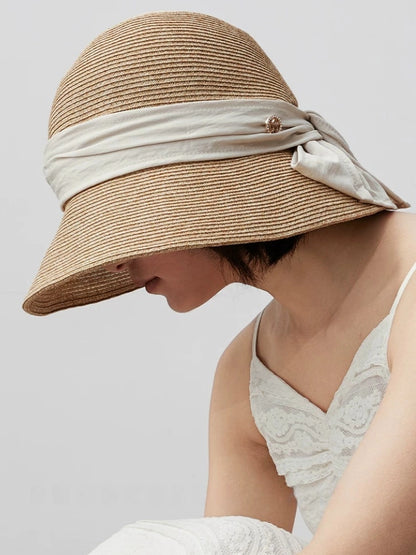 Moonlight white paper straw sun hat with breathable texture, wide brim and bow detail for daily sun protection.
