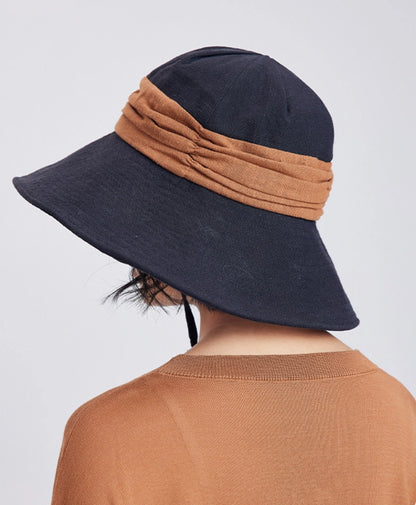 Back view of black brown ramie bucket hat with contrast band, foldable brim, and relaxed outdoor style.