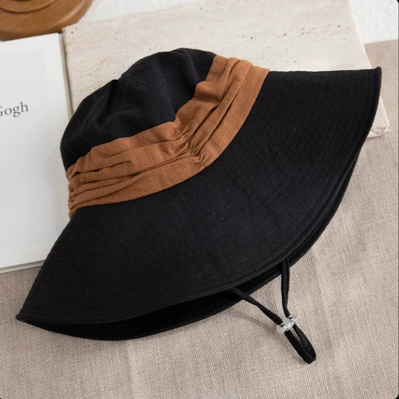 Black brown foldable wide brim sun hat with wind cord, breathable ramie cotton fabric, and travel-ready design.