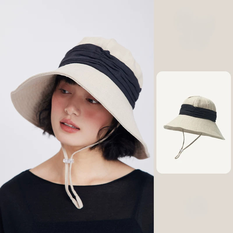 Ivory beige natural ramie wide brim bucket hat for women with breathable texture, wind cord, and summer travel style.