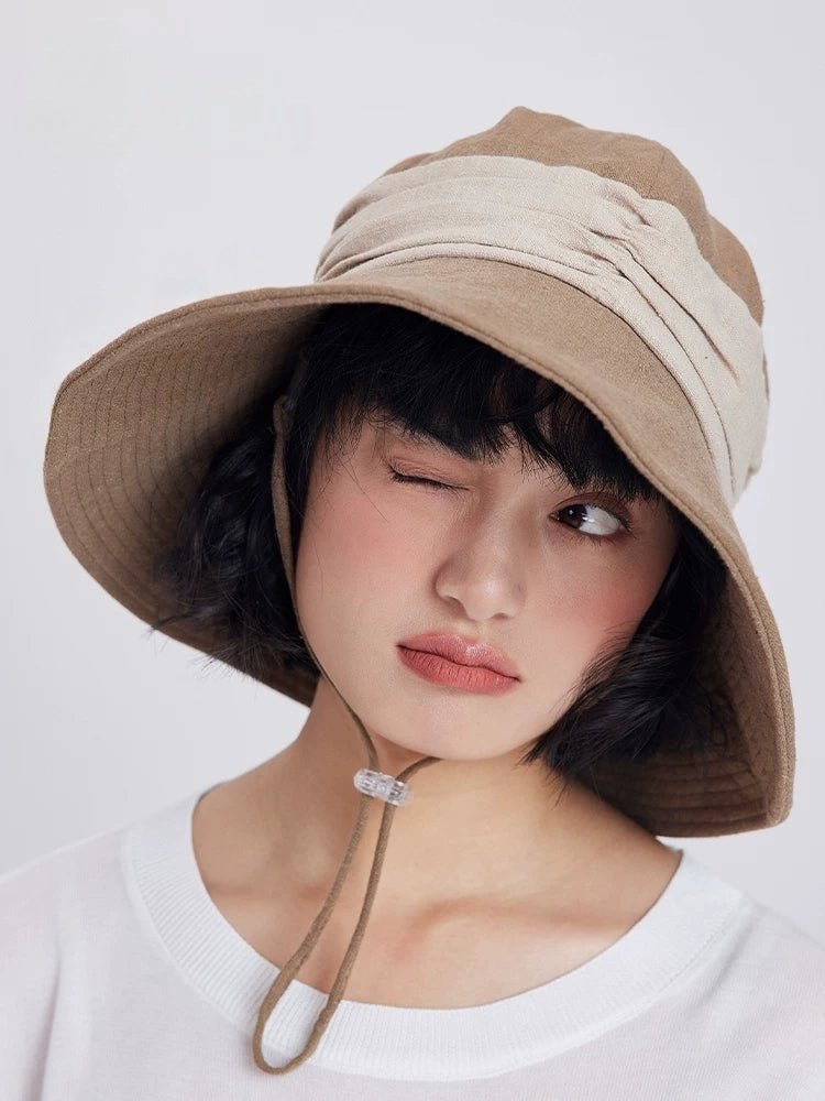 Khaki wide brim bucket hat with breathable ramie cotton fabric, wind cord, and relaxed summer styling.