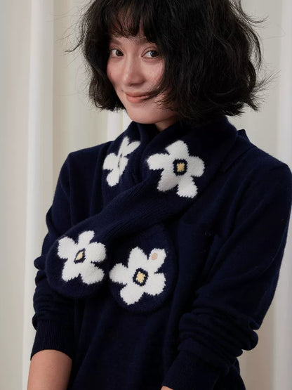 Navy wool keyhole scarf with white flowers, worn crossed over a matching navy sweater.
