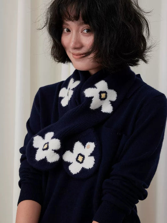 Navy wool keyhole scarf with white flowers, worn crossed over a matching navy sweater.