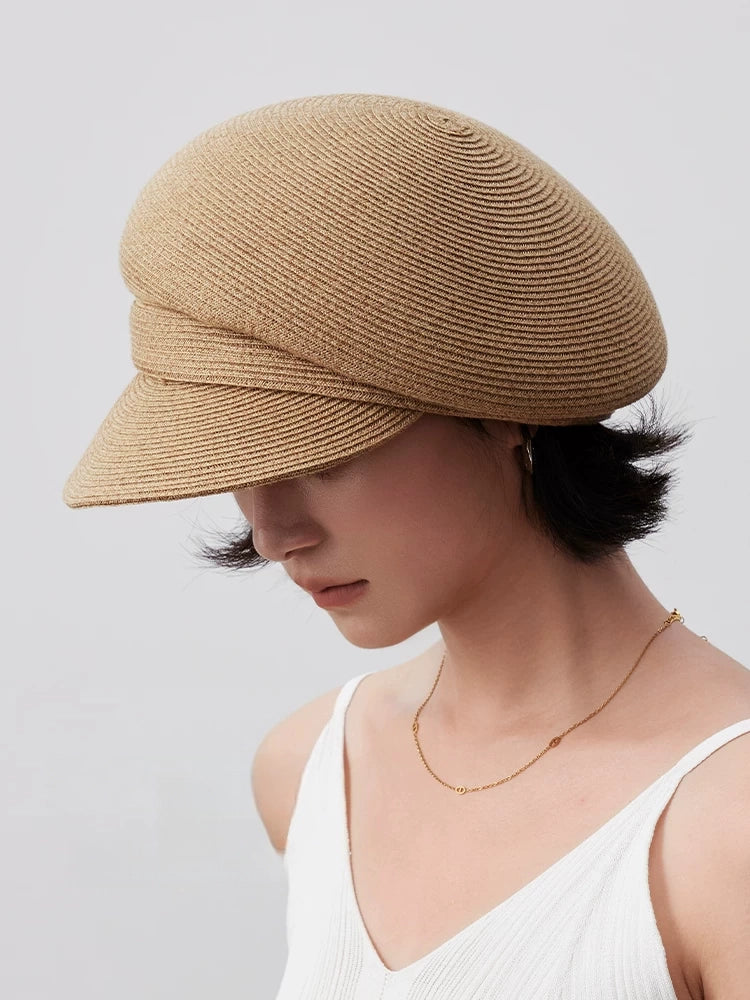 Paper straw beret styled with a sleeveless white top for a light summer outfit