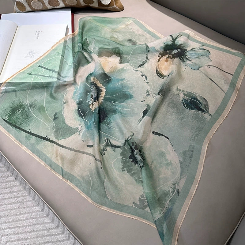 Flat lay of green floral silk square scarf, 100% mulberry silk with artistic botanical design