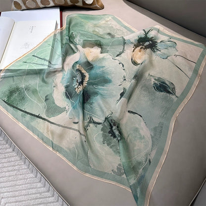 Flat lay of green floral silk square scarf, 100% mulberry silk with artistic botanical design