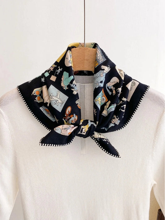 Black cartoon print silk wool square scarf styled as a knotted neckerchief