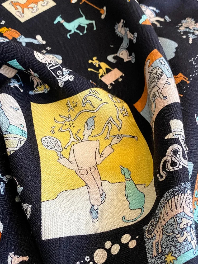 Close-up of whimsical multicolor illustrations on a black silk wool blend scarf