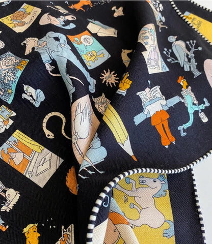 Detailed cartoon characters and graphic motifs on a black silk wool square scarf