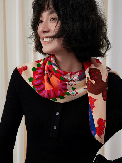 Woman wearing a red and cream folk lion mulberry silk scarf loosely wrapped around her neck