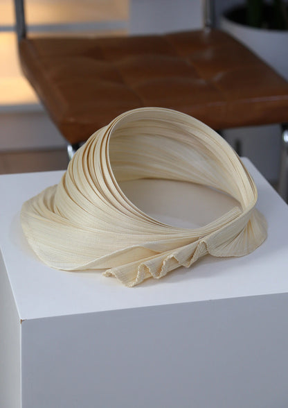 Pleated open top straw sun hat made from natural Buntal straw with adjustable fit.