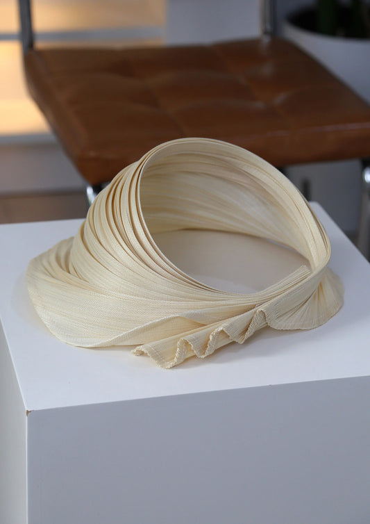 Pleated open top straw sun hat made from natural Buntal straw with adjustable fit.