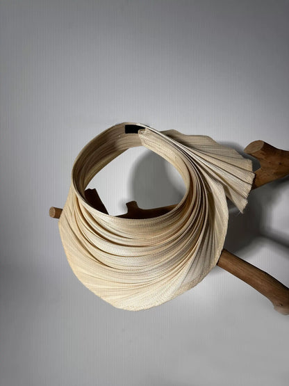 Buntal straw open top sun hat showing pleated extendable brim and natural summer texture.
