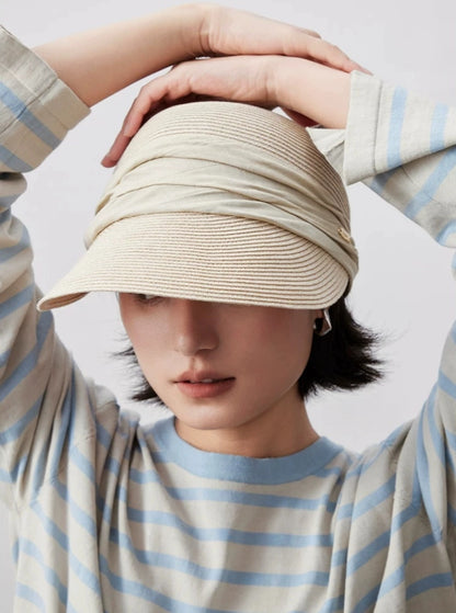 Foldable ivory sun visor hat with curved brim for travel and outdoor sun protection
