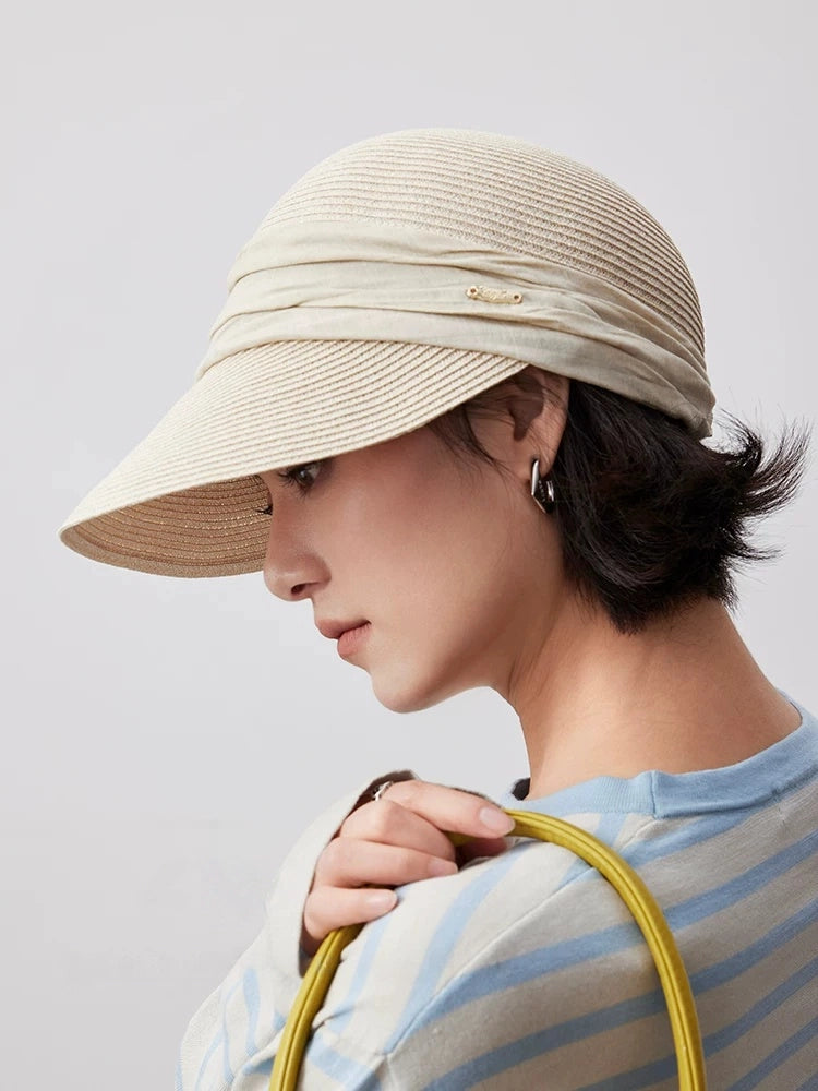 Ivory pleated ribbon visor hat styled for chic casual summer wear