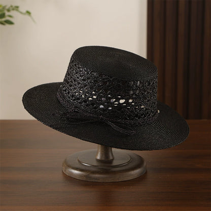 Black raffia straw boater hat with hollow crochet weave and structured wide brim.