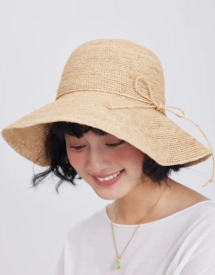 womens straw sun hat raffia wide brim soft silhouette summer outfit styling