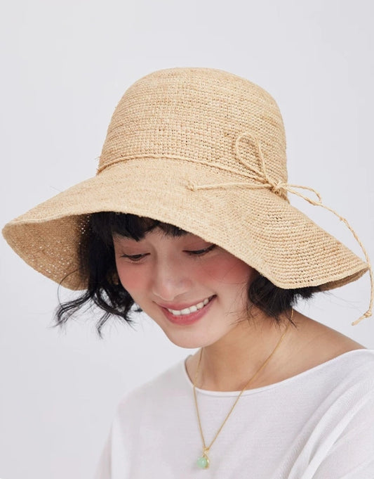 womens straw sun hat raffia wide brim soft silhouette summer outfit styling