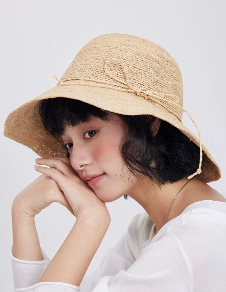 raffia sun hat lifestyle pose elegant womens beach sun hat natural tone
