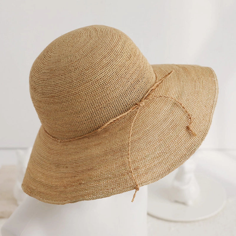 raffia straw hat detail handcrafted texture wide brim sun hat close up