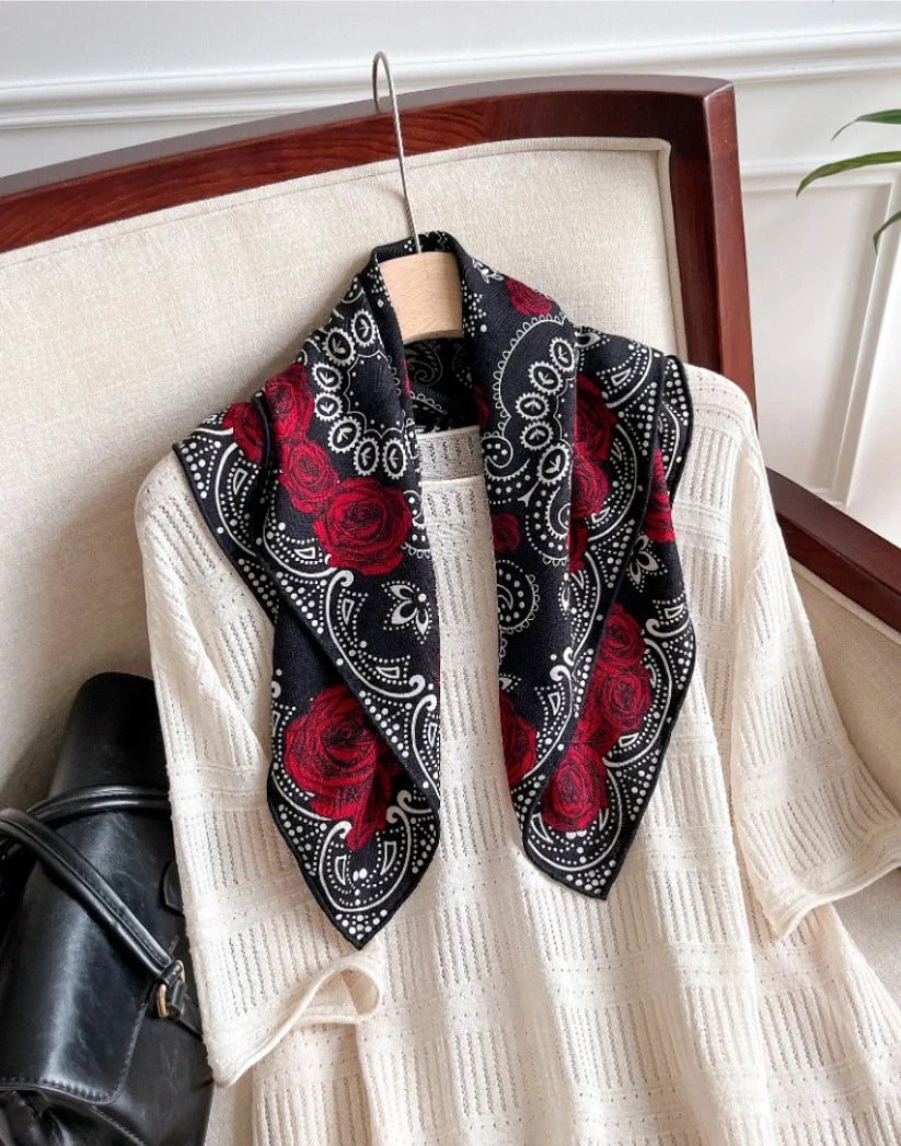 Woman wearing black silk wool square scarf around neck elegant styling