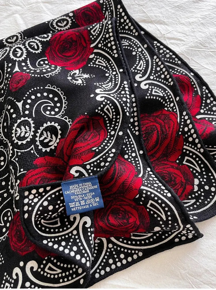 Close-up of silk wool fabric texture with rose and paisley detail