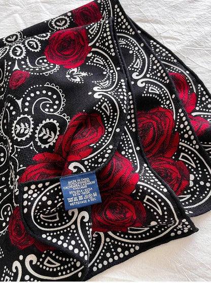 Close-up of silk wool fabric texture with rose and paisley detail