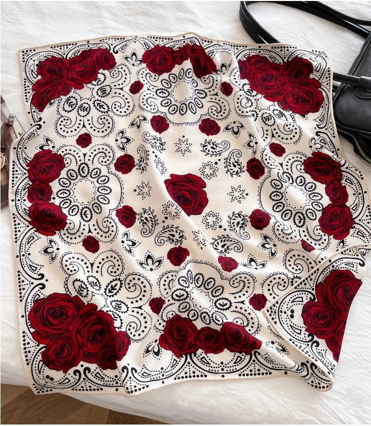 White silk wool square scarf with red rose and paisley print flat lay