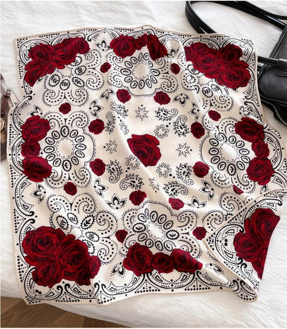 White silk wool square scarf with red rose and paisley print flat lay