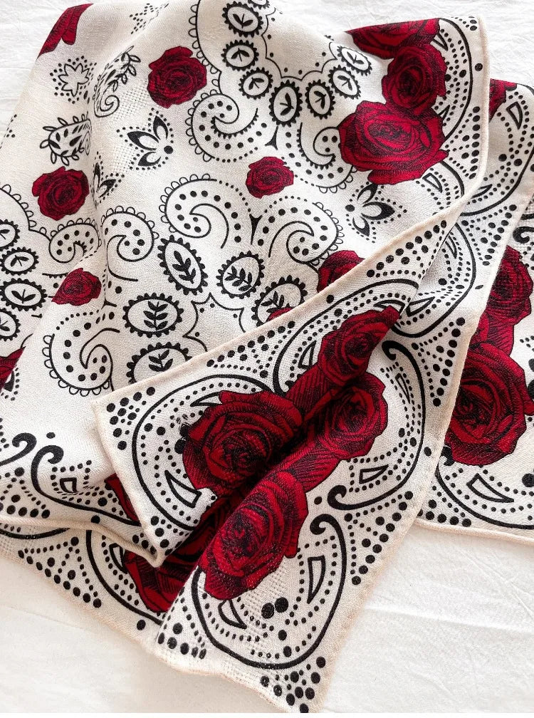 Close-up of soft silk wool blend fabric with rose pattern detail