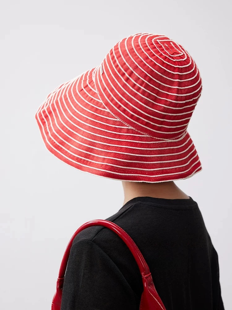 Back view of a red and white striped beach sun hat with a flexible packable design.